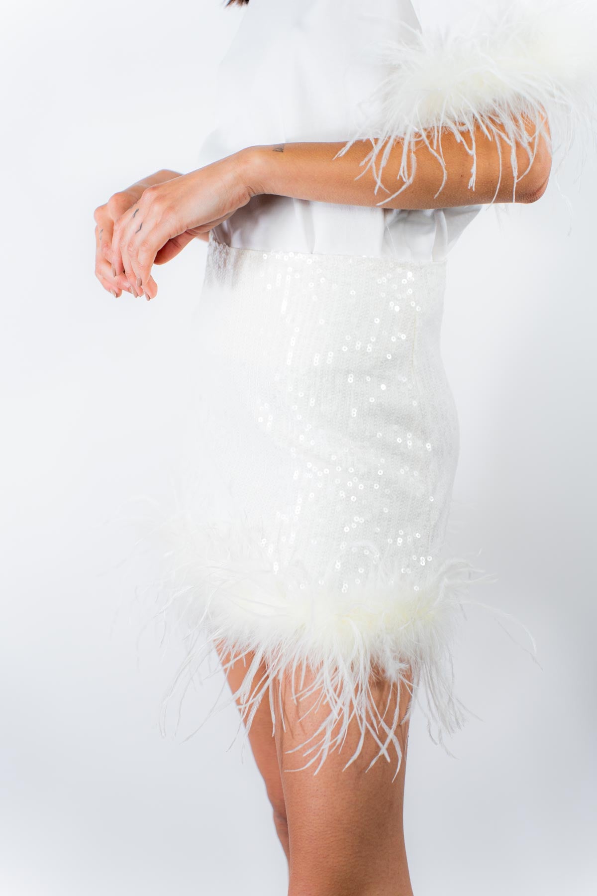Gonna in paillettes e piume